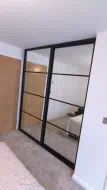 Black framed mirror doors divided into 4 section, fitted in Eston